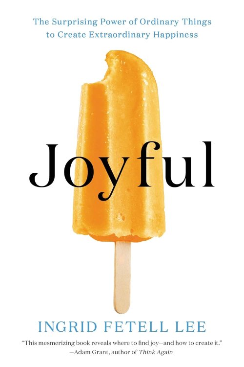 Book cover of Joyful by Ingrid Fetell Lee, featuring a bright orange popsicle with a bite taken out, centered on a white background. The subtitle reads: “The Surprising Power of Ordinary Things to Create Extraordinary Happiness.”